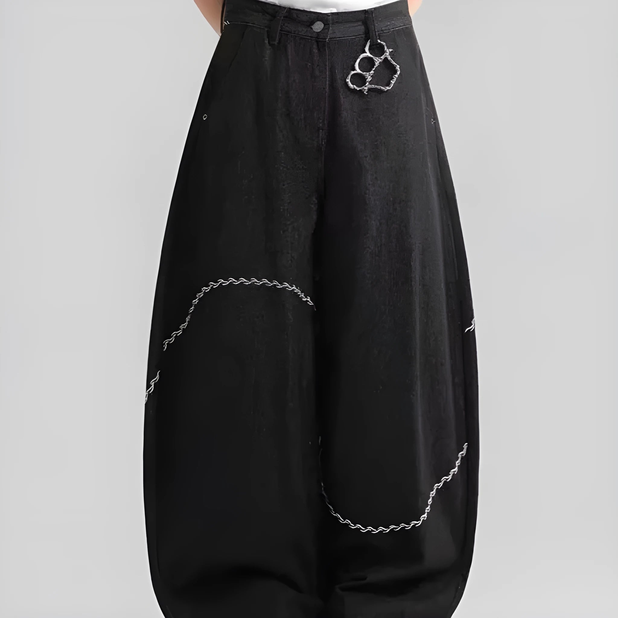 Black straight-leg denim trousers with micro-elastic waist and zip fly closure