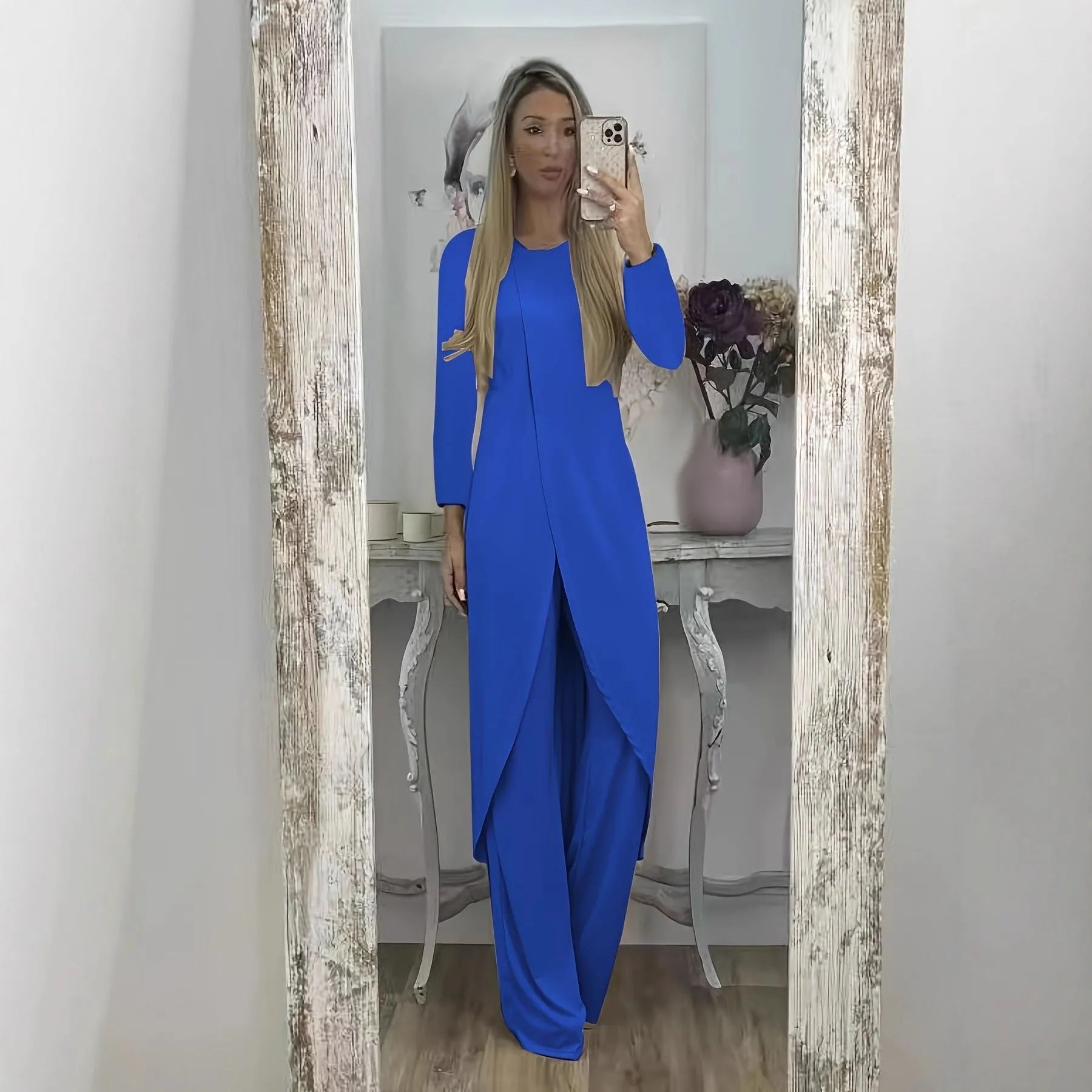 Casual long sleeve two-piece loungewear set in a neutral colour, showing the loose round neck top and matching trousers.