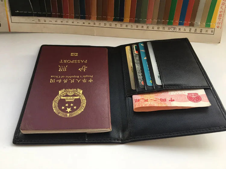 Black RFID antimagnetic passport holder made of genuine leather, open showing card slots and passport slot, 15cm long.