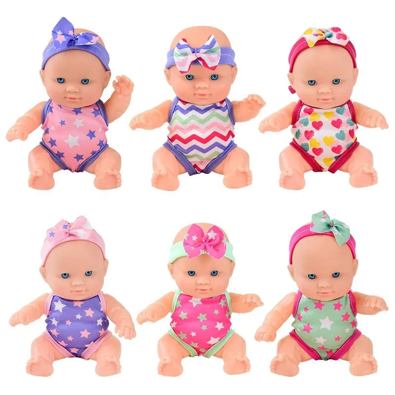Vinyl baby figurine doll in presentation box, 21.5 cm tall, available in six colours.