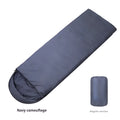 Navy blue adult camping sleeping bag for winter use on an outdoor background.