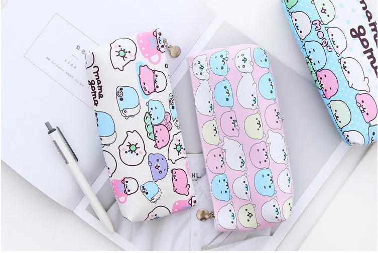 Creative Corner PU leather triangle pencil case in blue with cartoon creature design and large zipper