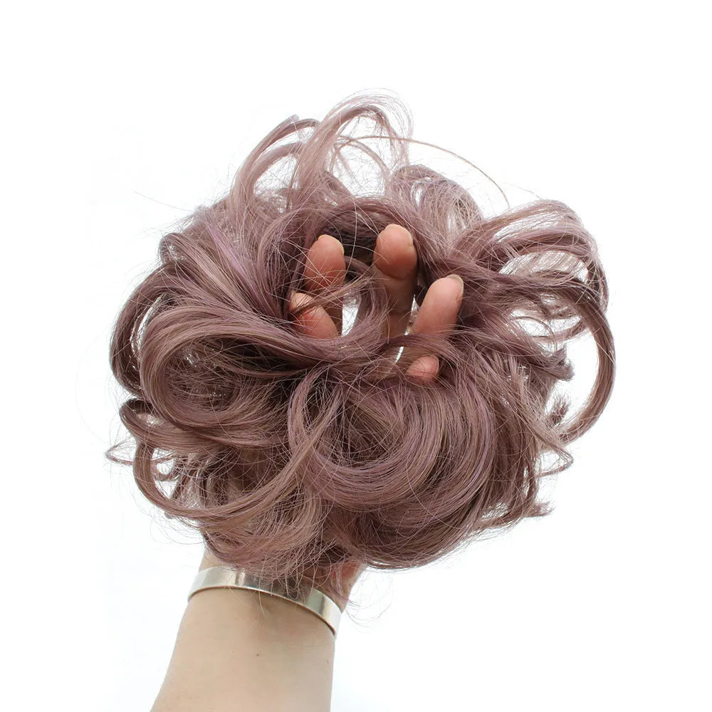 Adjustable hair ring in a natural black shade for creating hair buns and ponytails