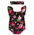 White baby girl's sleeveless cotton romper with small flying sleeves on a hanger.