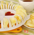 White plastic potato chips maker set with tray, stander, and slicer on a kitchen surface