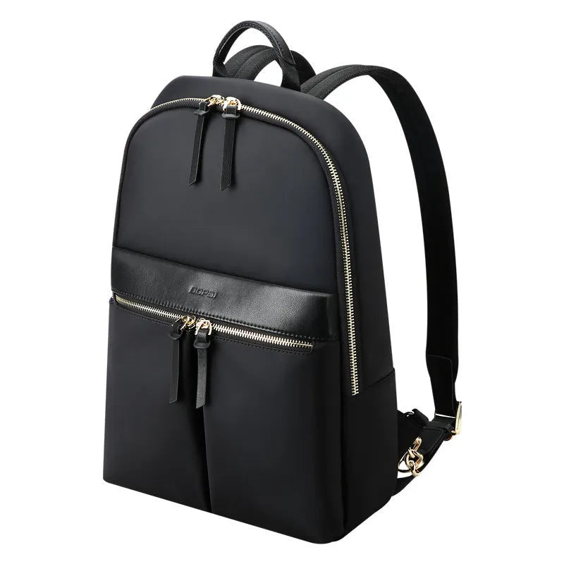 Women's black nylon backpack with zipper opening, internal computer sleeve, and phone pocket