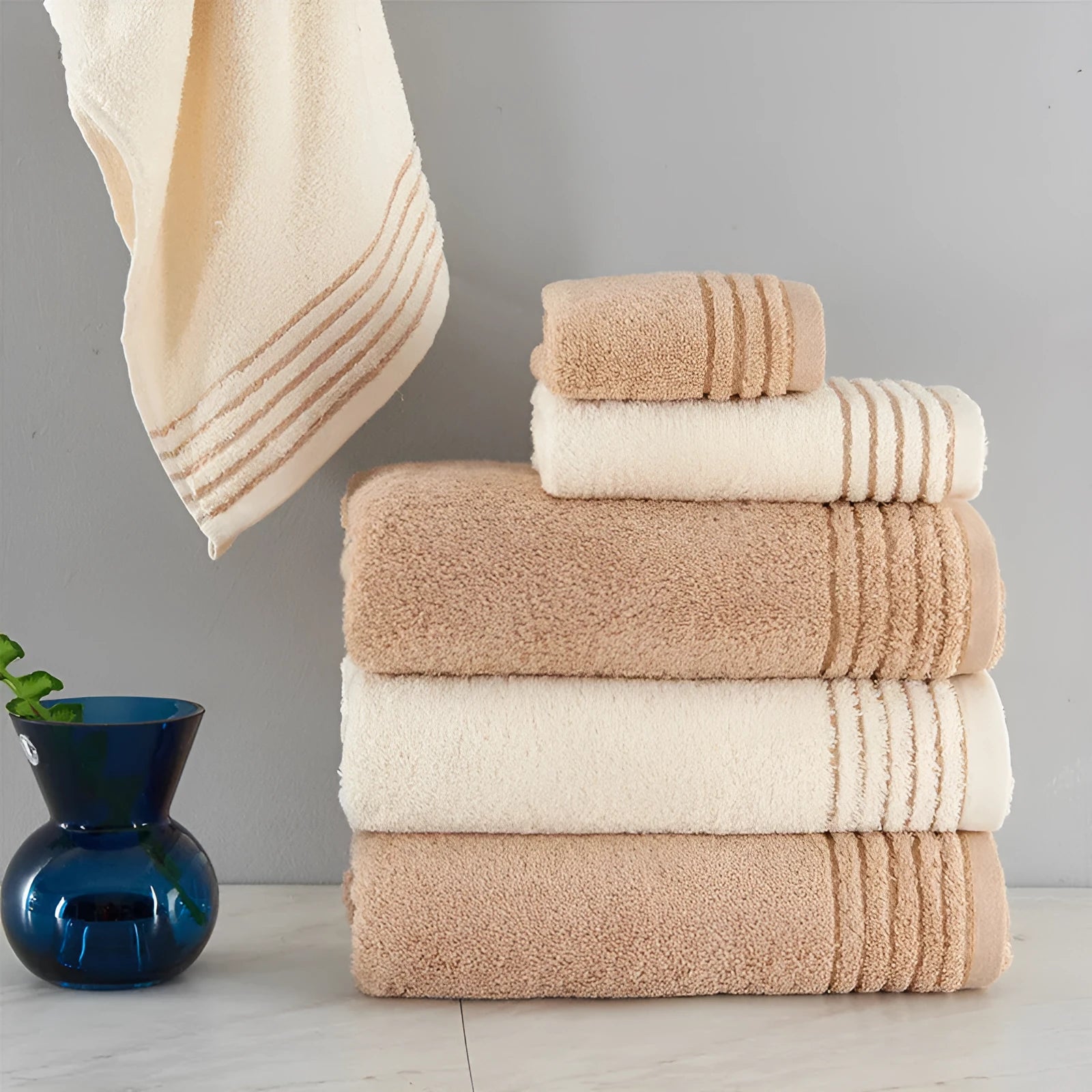 Six-piece cotton towel set showing bath, hand, and washcloth sizes in beige colour.