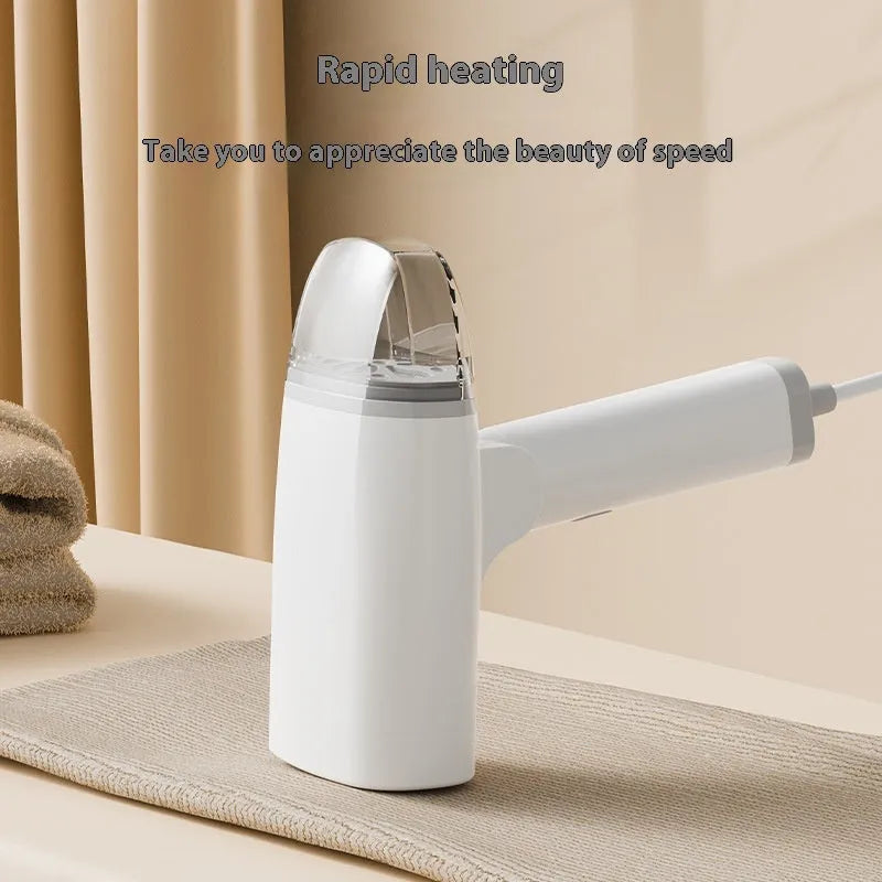Blue handheld garment steamer with water tank and mechanical controls for clothing care