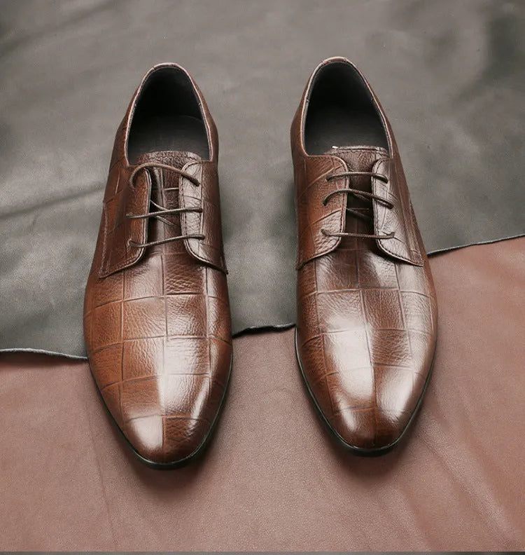 Men's black checkered leather derby shoes with a pointed toe and rubber sole.