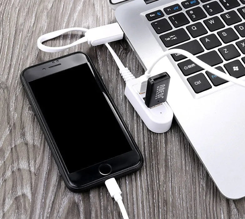 Cable separator hub with 3 USB ports and Micro USB interface on a desk