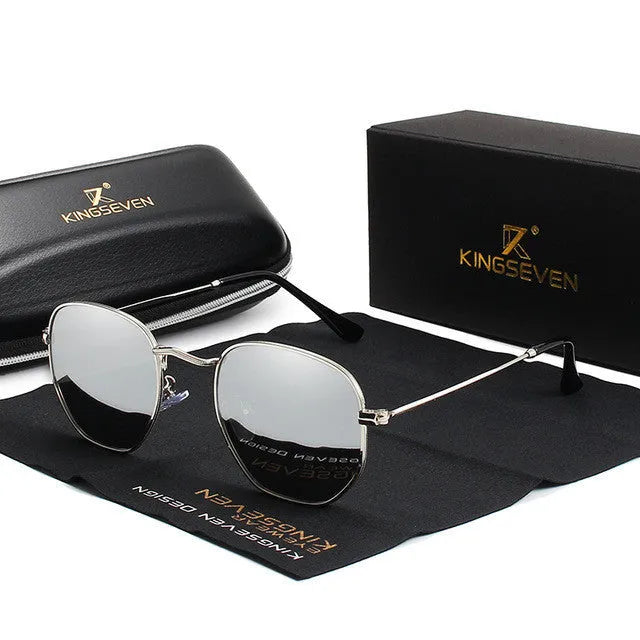 Classic round polarised sunglasses for men in gun metal grey with adjustable nose pads on a wooden table.