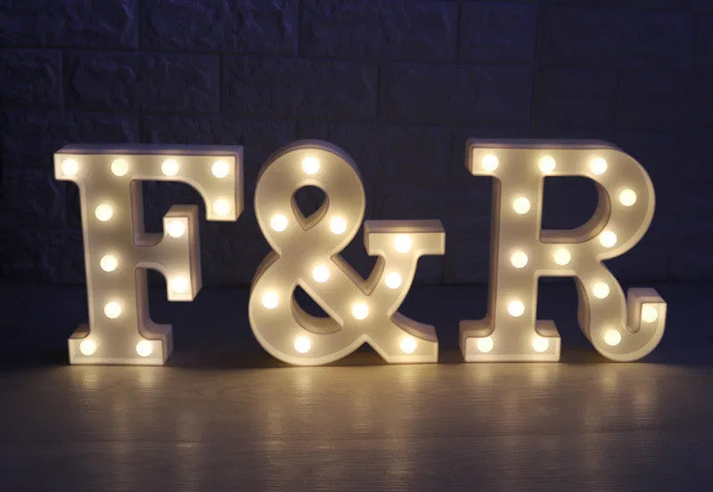 White plastic LED marquee letter sign with warm white glow, 22cm tall