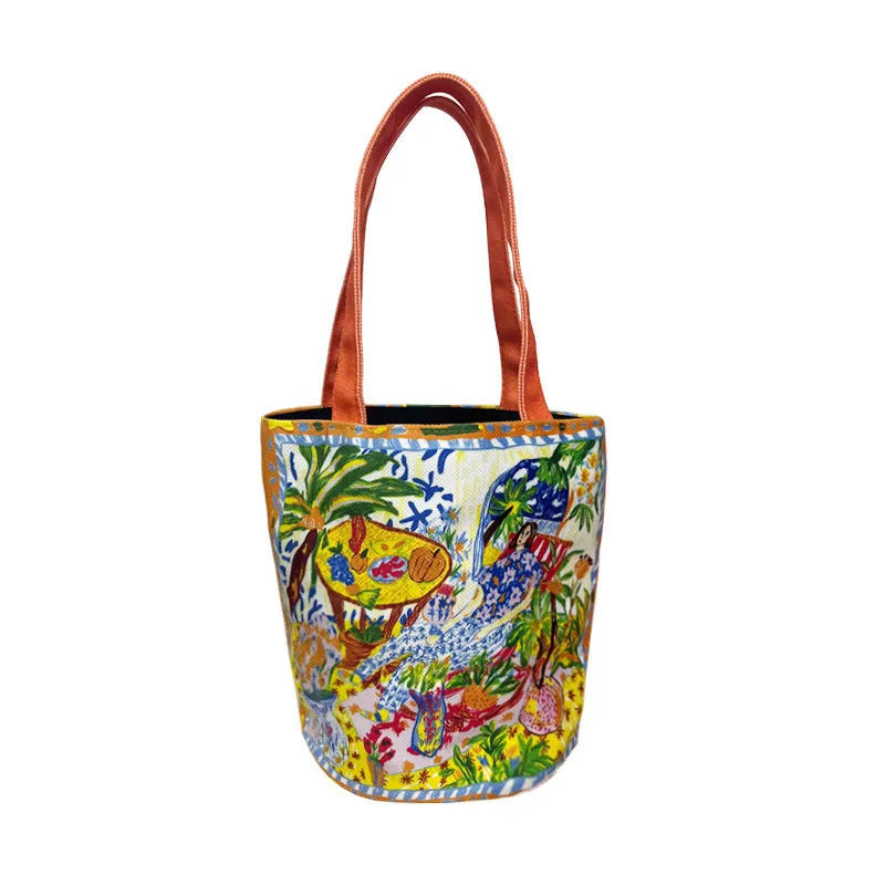 Orange canvas bucket handbag with double shoulder straps and printed letter design