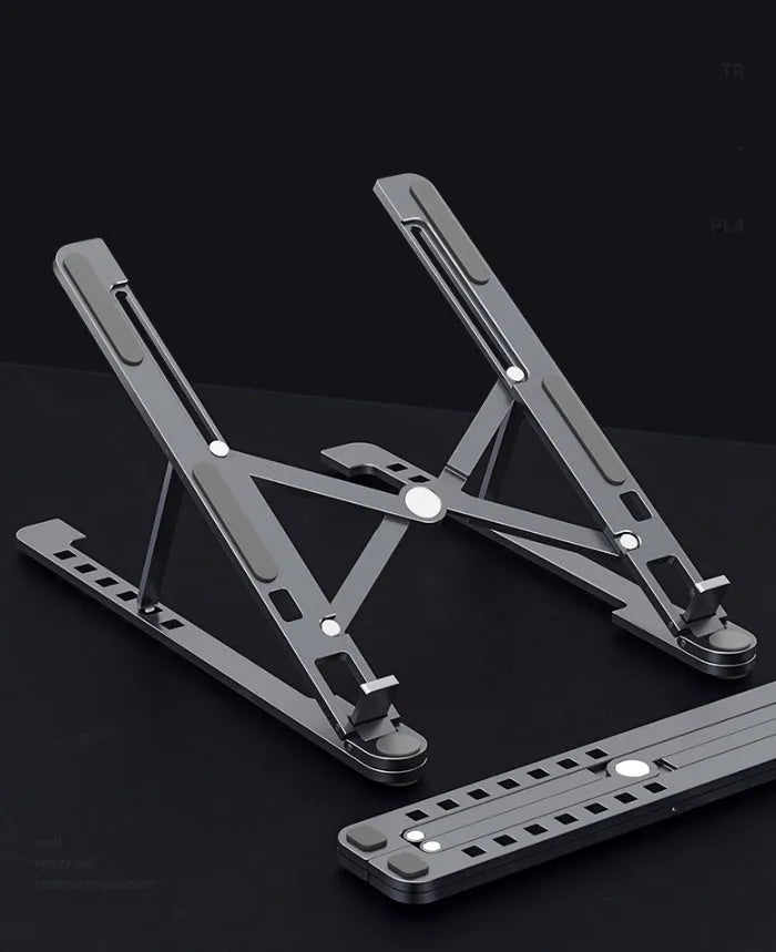 Aluminium foldable laptop stand shown in silver colour, adjusted to a mid-height position.