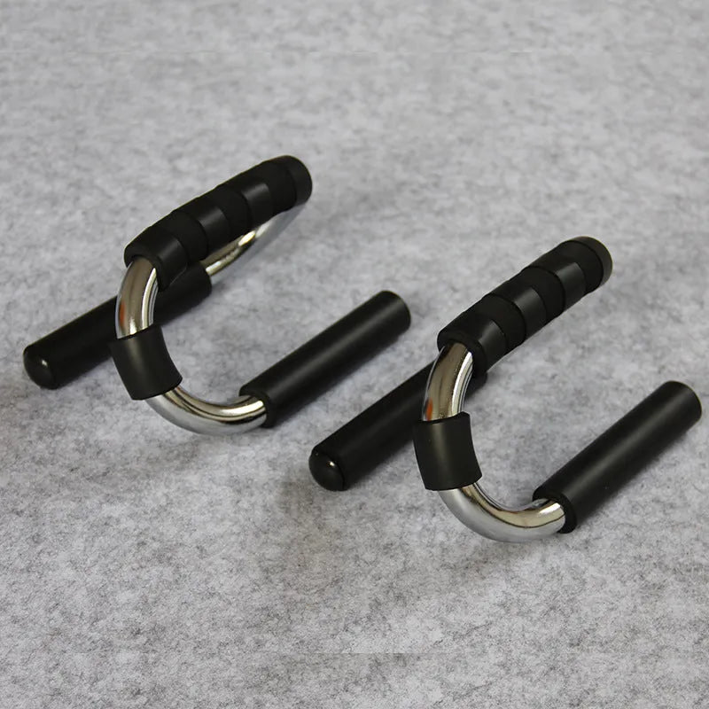 Green suction cup push up stand with electroplated steel frame and foam handles on a smooth floor