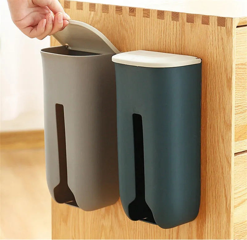 Wall-mounted plastic bag storage box in Nordic green with top flip lid and bottom extraction slot