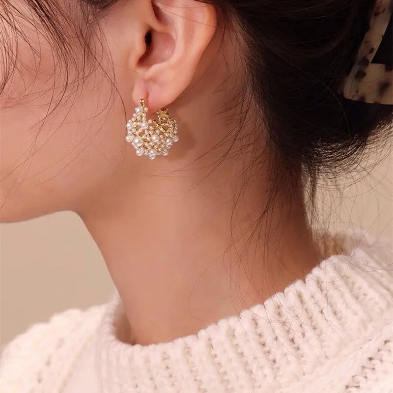 Gold-coloured copper flower basket earrings with small rice-shaped bead inlay for women