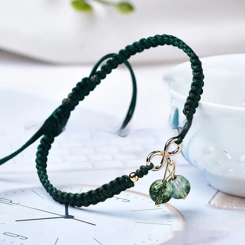 Natural Strawberry Quartz beaded bracelet with a crystal cherry charm on a stretch cord.