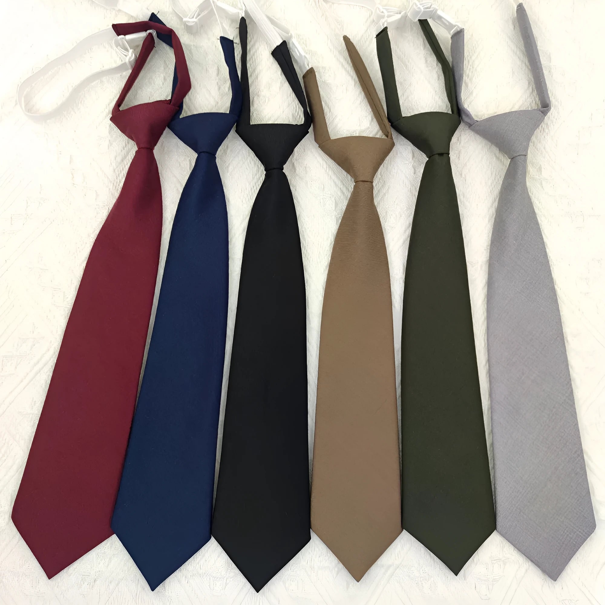 Navy blue cotton bow tie in arrow style with tie-dye processing measuring 35cm by 7cm