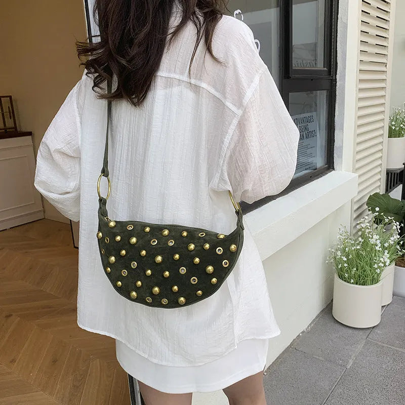 Retro rivet shoulder bag in frosted imitation buckskin with single strap and sewing line detail on a white background