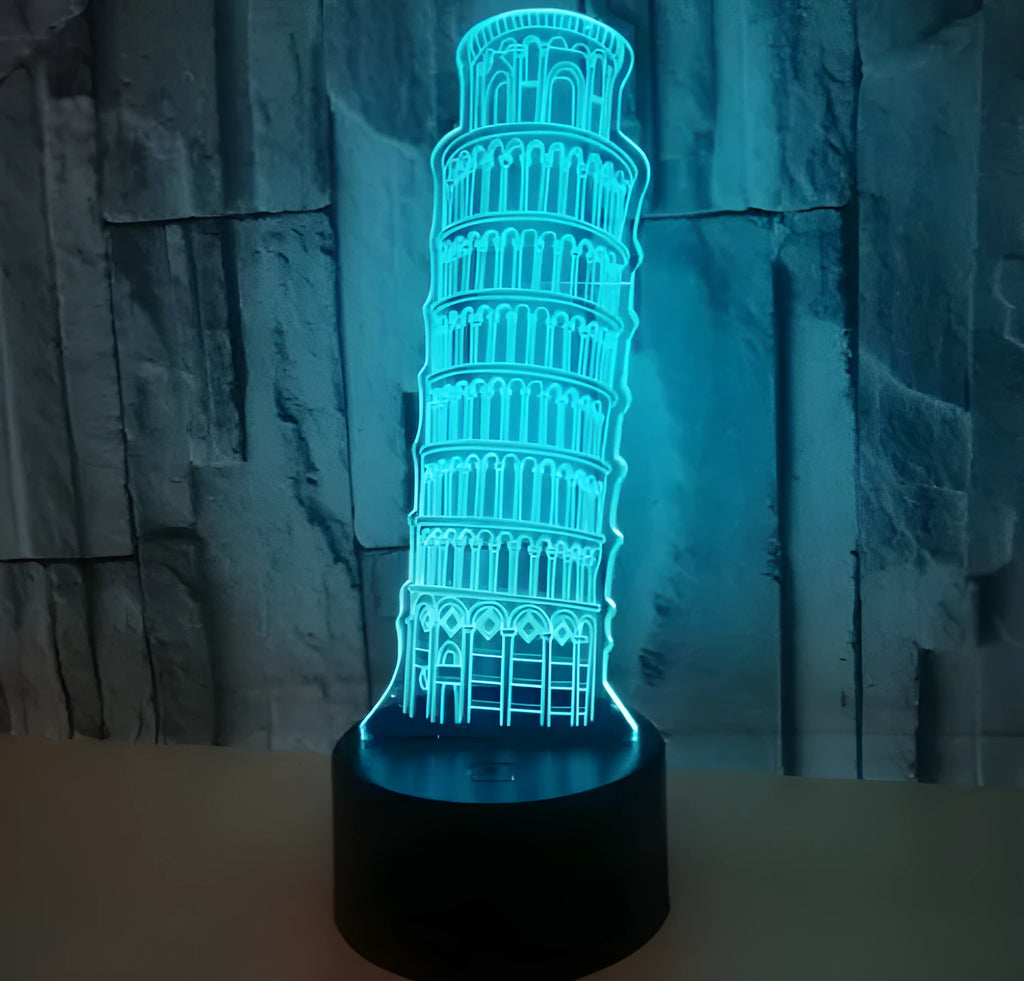 3D laser-cut Leaning Tower of Pisa acrylic night light glowing in blue on a black base.