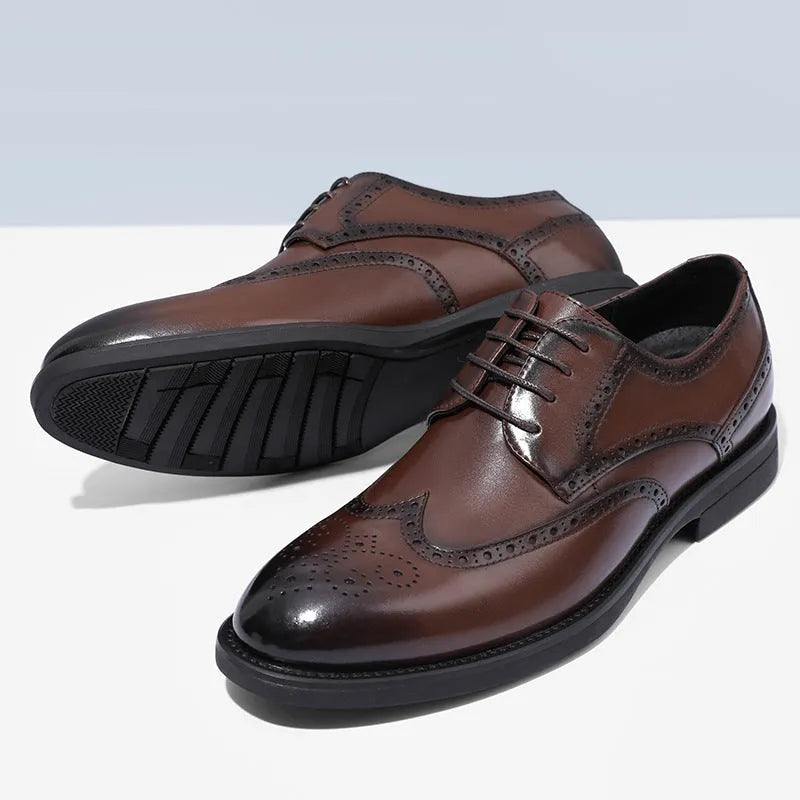 Men's classic brown brogue leather business shoes on a white background.