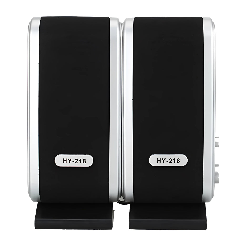 A black notebook mini speaker with a USB cable for computer audio.