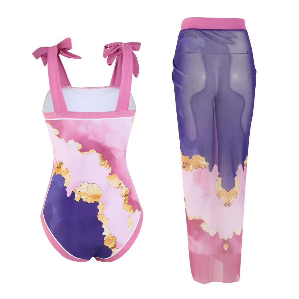 Floral print conservative one-piece swimsuit with mesh tube top and matching skirt.