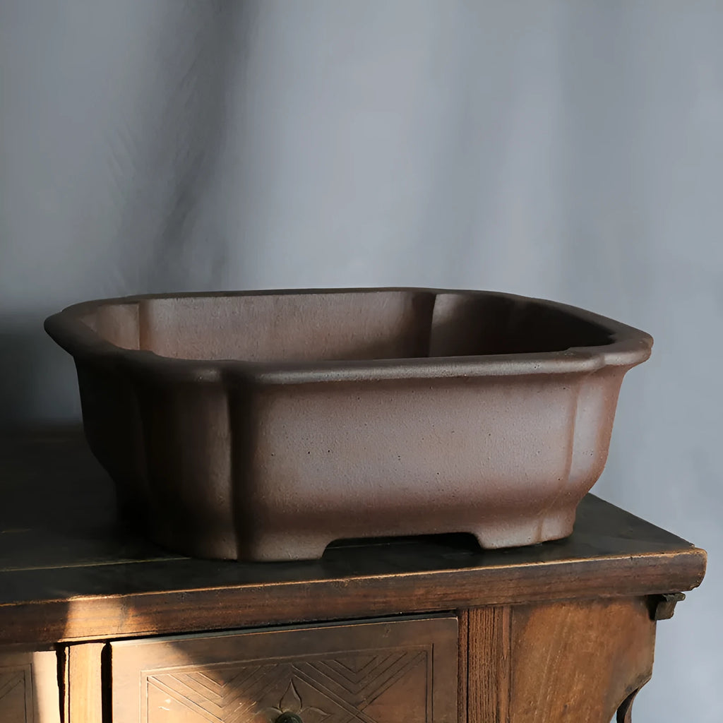 Purple sand rectangular bonsai flower pot with modern geometric design on floor surface