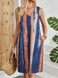 V-neck sleeveless dress with colour-block striped pattern on a mannequin