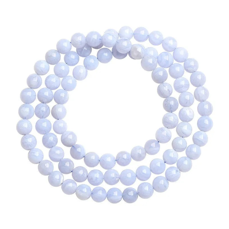 Blue agate beaded bracelet with Ruyi design elements and scattered striped beads