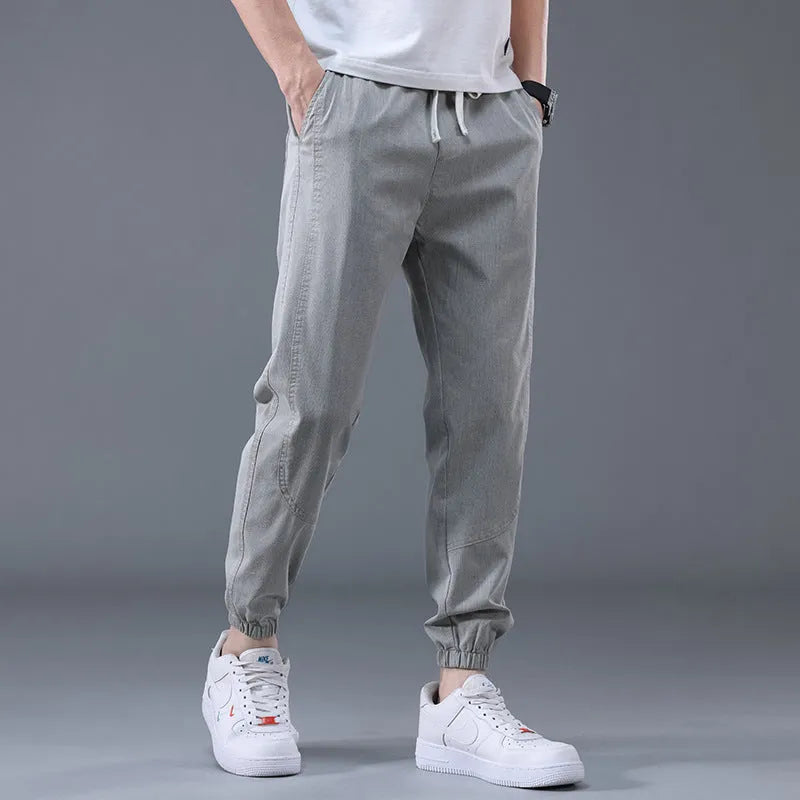 Men's casual loose drawstring pants in black, tapered high-waist solid colour cotton-blend trousers