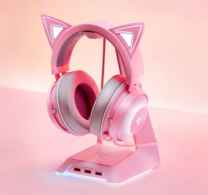 Pink glowing cat earphones with wired USB connection and LED lights on a head-mounted frame