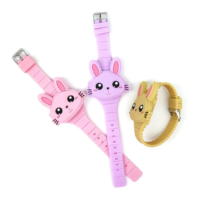 Children's electronic watch with 55mm plastic cartoon dial, silicone strap, and stainless steel pin buckle on a child's wrist