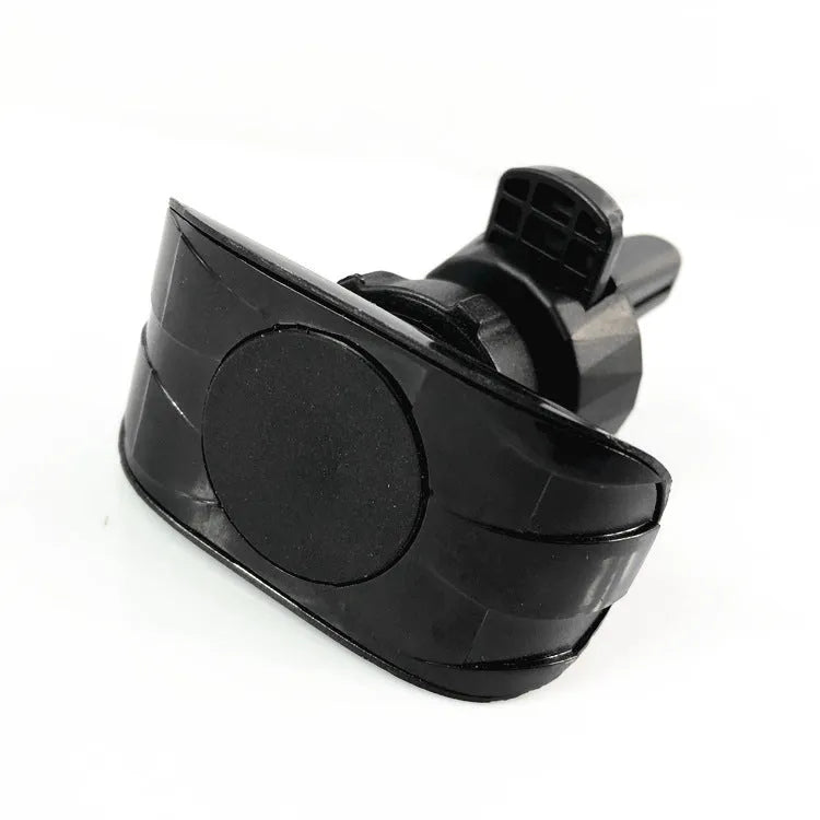Matte black car phone holder clipped onto a car air vent, holding a smartphone.