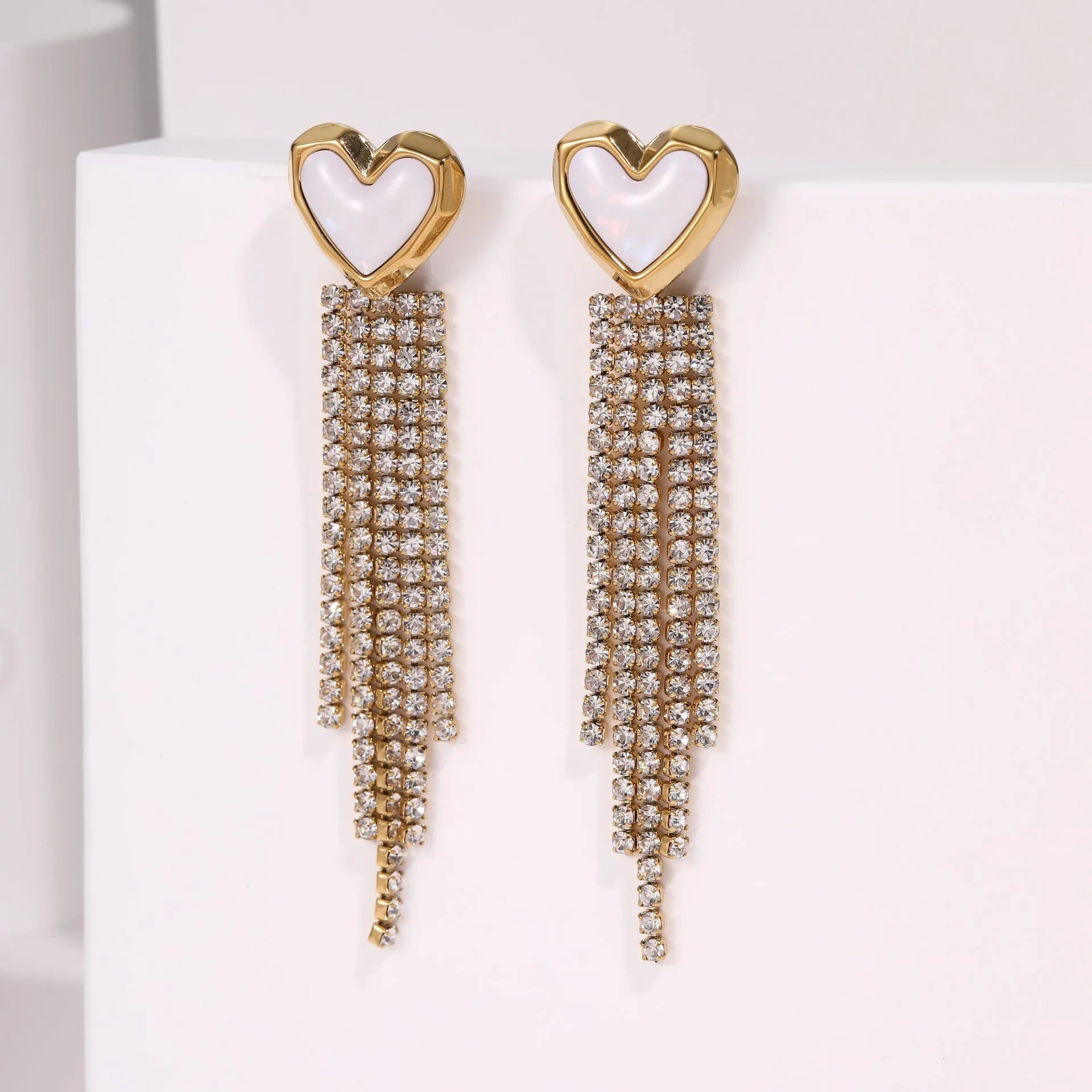 Women's stainless steel earrings with 18K electroplated gold finish showing heart and star shape designs