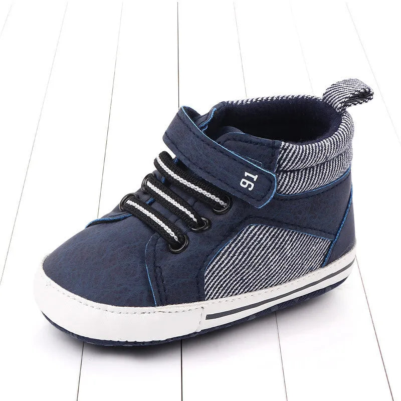 Blue cotton high-top toddler shoes with velcro strap for boys on white background