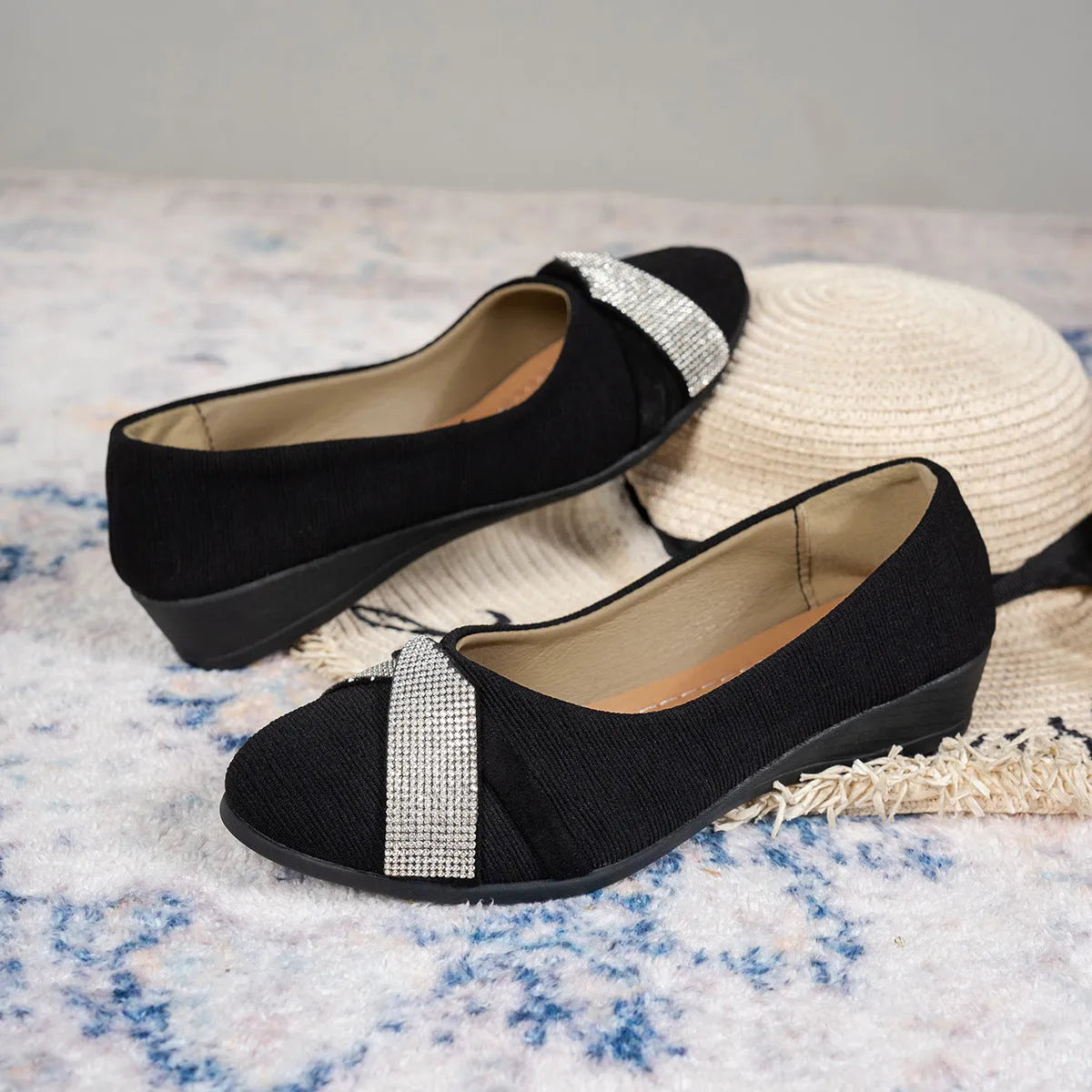 Black women's slip-on casual shoes with round toe, rhinestone detail, and a short chunky heel.