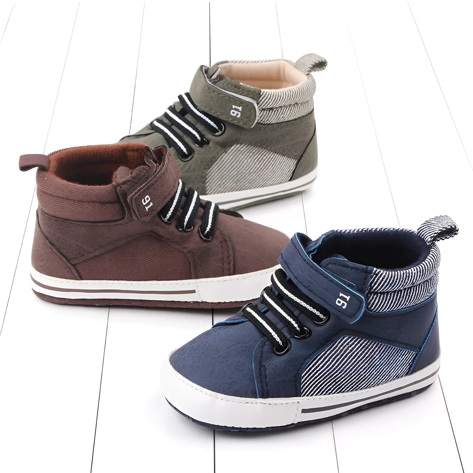 Blue cotton high-top toddler shoes with velcro strap for boys on white background
