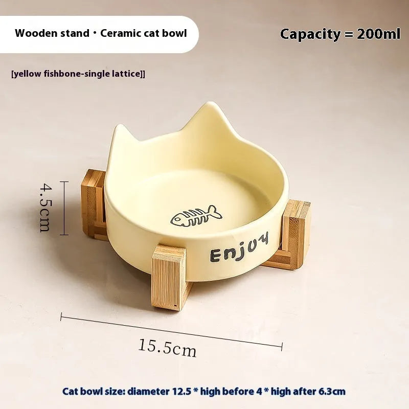 Porcelain cat bowl with cat ear and paw design on a wooden feeding frame, in pink colour.