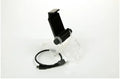 Black PS4 DualShock controller clip holding a mobile phone, with a Micro USB OTG cable for connection.