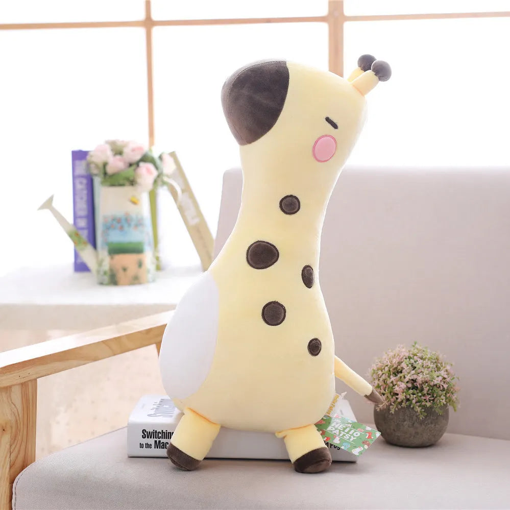 Pink Sika Deer plush doll with short plush fabric, 30cm tall, on a bed