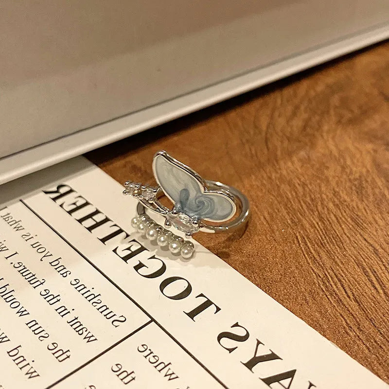 Simple copper women's ring with a Chinese butterfly design, showing an example from the 33 available numbered styles.