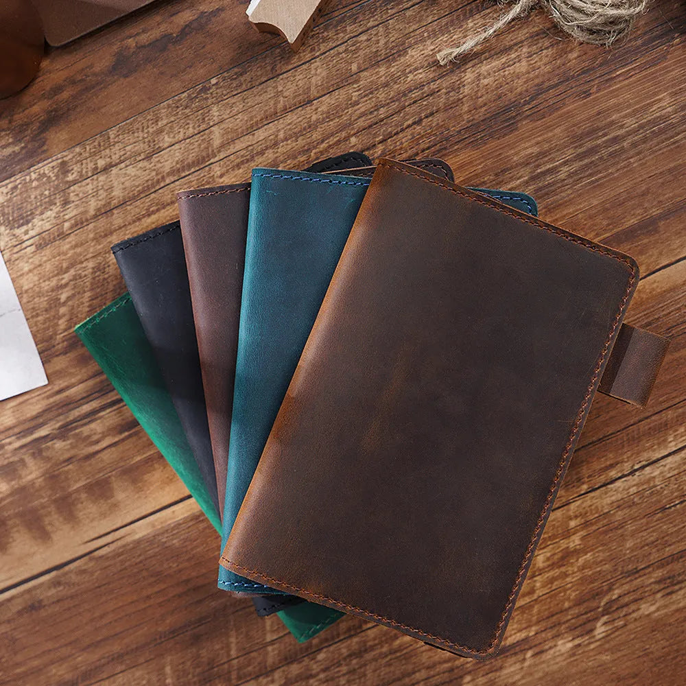 Handmade kraft notebook with cowhide cover showing dark green colour and 9x14cm wood-free paper pages