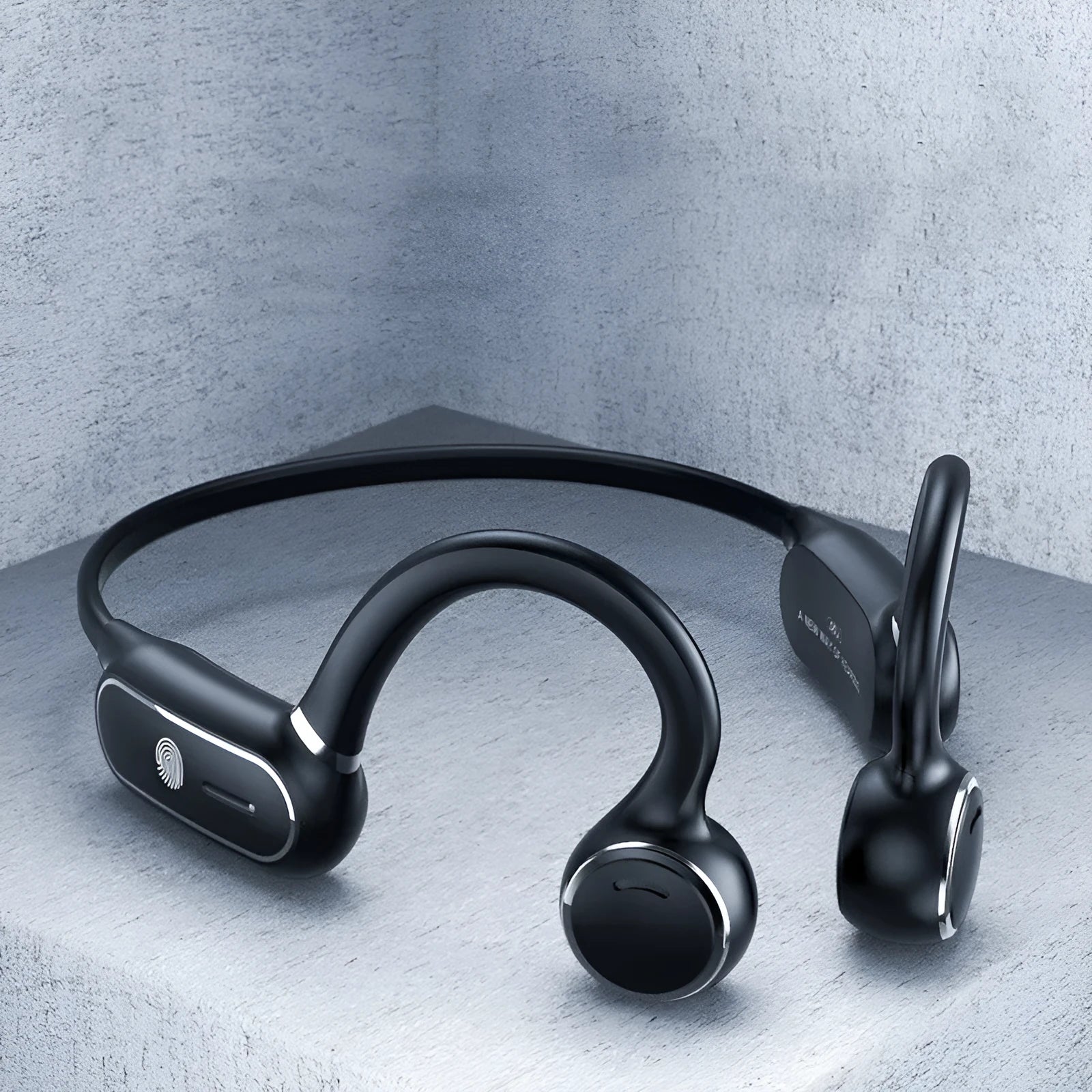 Black air conduction wireless earphones with an over-ear hook design and titanium alloy frame.