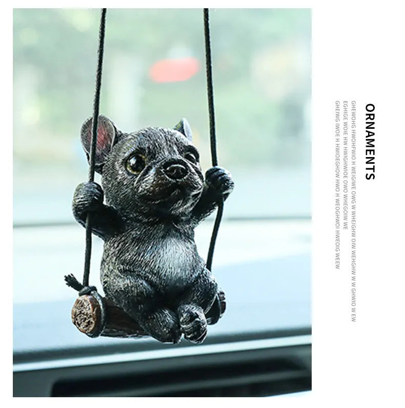 Small resin bulldog cartoon pendant for hanging on a car rearview mirror.