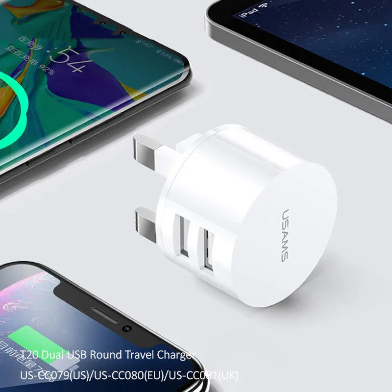 White dual USB phone charger with international plugs for US EU UK regions showing compact 39mm diameter design