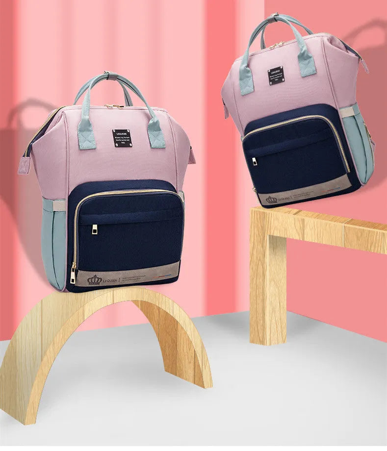 Mummy maternity bag backpack in solid colour with zipper closure and nylon finish