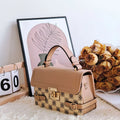 Retro small square pattern crossbody bag in apricot colour, showing horizontal square shape and stitching detail.