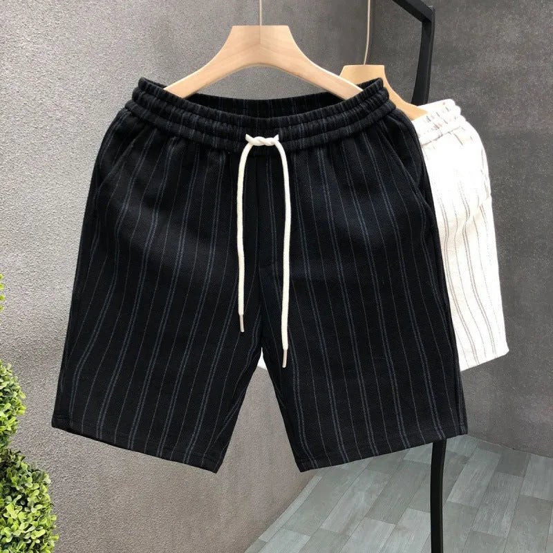 Men's black and white striped fleece-lined casual shorts showing straight leg and ankle band design.